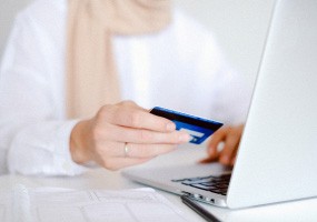 A patient is inputting her financial info into the system.