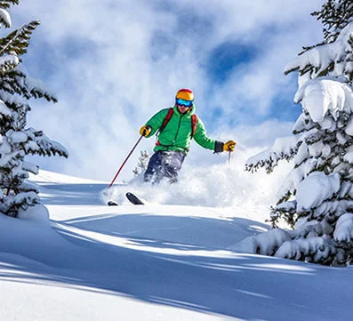 man skiing down snowing hill