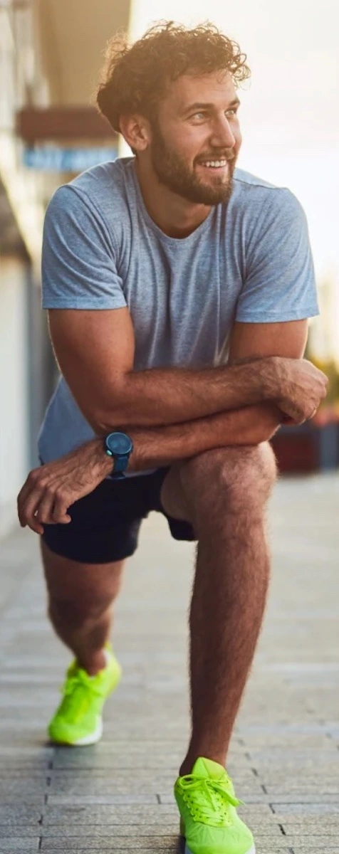 young man looking in the distance while running