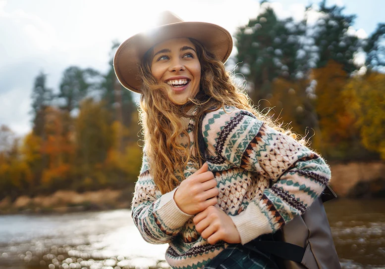 Young woman enjoying nature walk free from glasses
