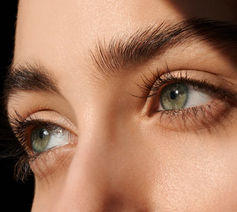 young woman's green eyes close up