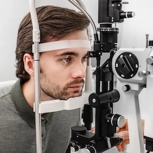 young man during eye exam vision test