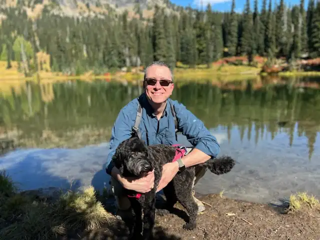 Dr Patrick Munson and his dog on a hike